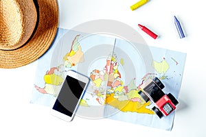 Children tourism outfit with map and phone on white background flat lay mockup