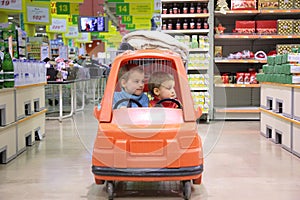 Children in toy automobile