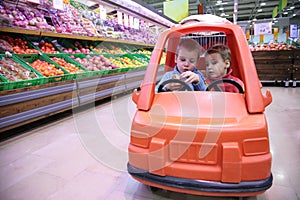 Children in toy automobile