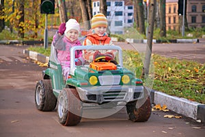 Children in toy car