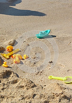 Children toys on the beach with clean blue water