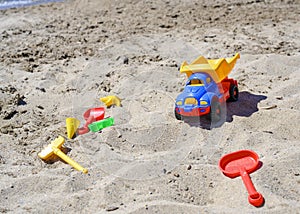 Children toys on the sand on the beach in summer