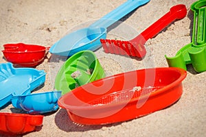 Children toys using for playing on sand at beach. Vacation and relaxation time