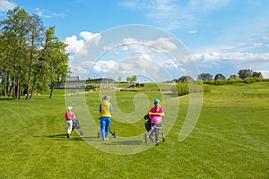 Children with trainer at golf