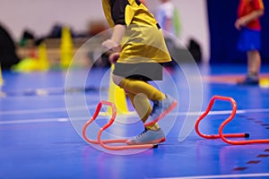 Children training futsal jumping drills. Futsal indoor soccer training session