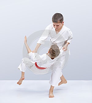 Children are training judo throws