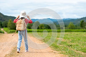 Children travel nature summer trips. Asia people tourism walking on nature road happy and fun explore