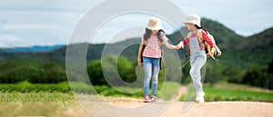Children travel nature summer trips. Asia people tourism walking on nature road happy and fun explore adventure