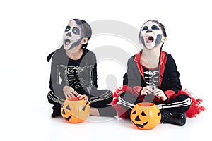 children trick or treating on white background