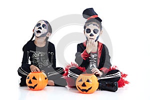 children trick or treating on white background