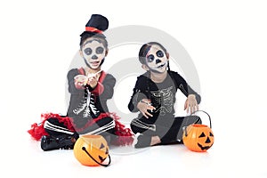 children trick or treating on white background