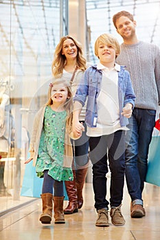 Children On Trip To Shopping Mall With Parents