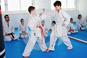 Children trying in sparring to use new moves