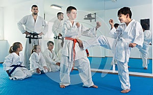 Children trying in sparring to use new technique