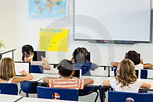 Children using digital tablets