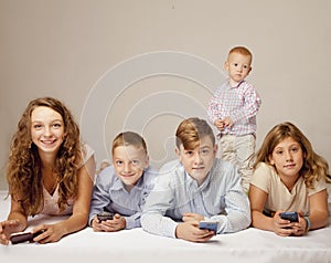 Children using electronic gadgets and smart phones. Education, f