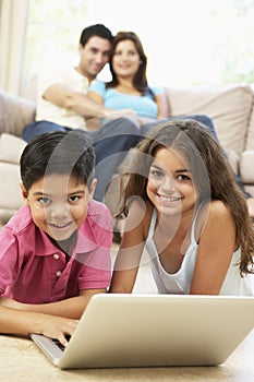 Children Using Laptop At Home