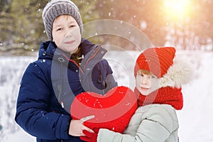 Children with valentines heart in hands