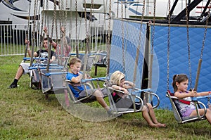 Children wait for a ride to start