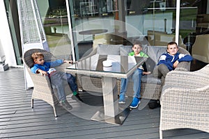 Children waiting food in outdoor cafe