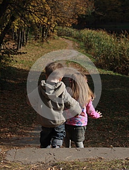 Children walking in the autumn park