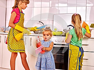 Children wash kitchen.