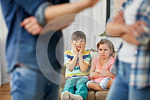 Children watching their parents quarreling at home