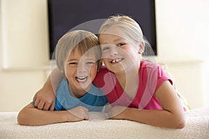 Children Watching Widescreen TV At Home