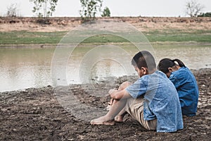 Children and water on arid soil in hot.