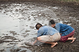 Children and water on arid soil in hot.