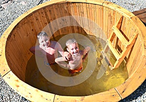 Children in the water barrel