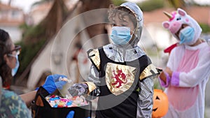 Children wearing costumes and face masks on Halloween 2020.