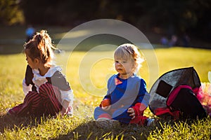 Children wearing Halloween suits in the park