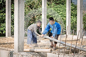 Children who work hard on the construction site, child labor , World Day Against Child Labour concept