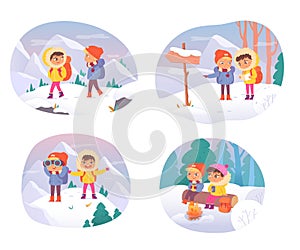 Children in winter adventure, hiking to mountain camp, little boy, girl with backpacks