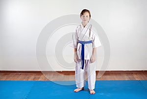 Children work out techniques of martial arts. Fighting position