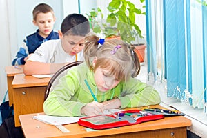 Children write at a lesson