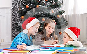 Children writing letter to santa, wait for christmas