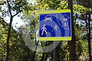 Children yard road sign on blurred background of trees