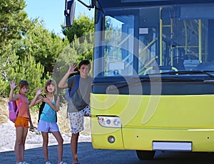 Children and yellow school bus