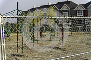 Childrend playground under construction behind a fence photo