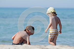 Childrend playing on beach photo