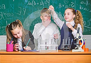 Childrens day. Chemistry. Back to school. Little kids learning chemistry in school lab. Little children at school lesson