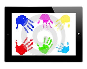 Childrens hand prints on tablet