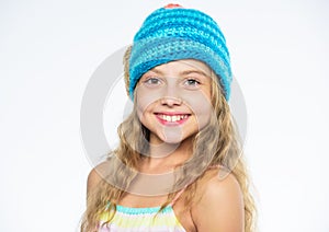 Childrens knitted hats. Girl long hair happy face white background. Kid wear warm soft knitted blue hat. Difference