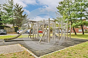 a childrens playground with a slide in a park