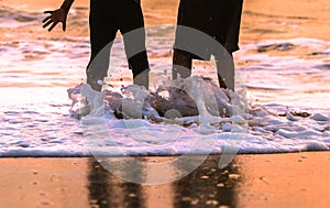 Childrens playing on the beach on summer holidays.