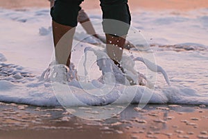 Childrens playing on the beach on summer holidays.