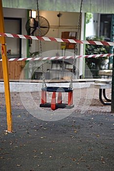 Childrens public park closed with danger tape during the coronavirus crisis lockdown