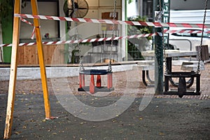 Childrens public park closed with danger tape during the coronavirus crisis lockdown